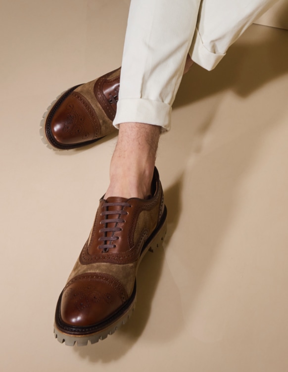brown leather and tan suede wingtip with lug sole
