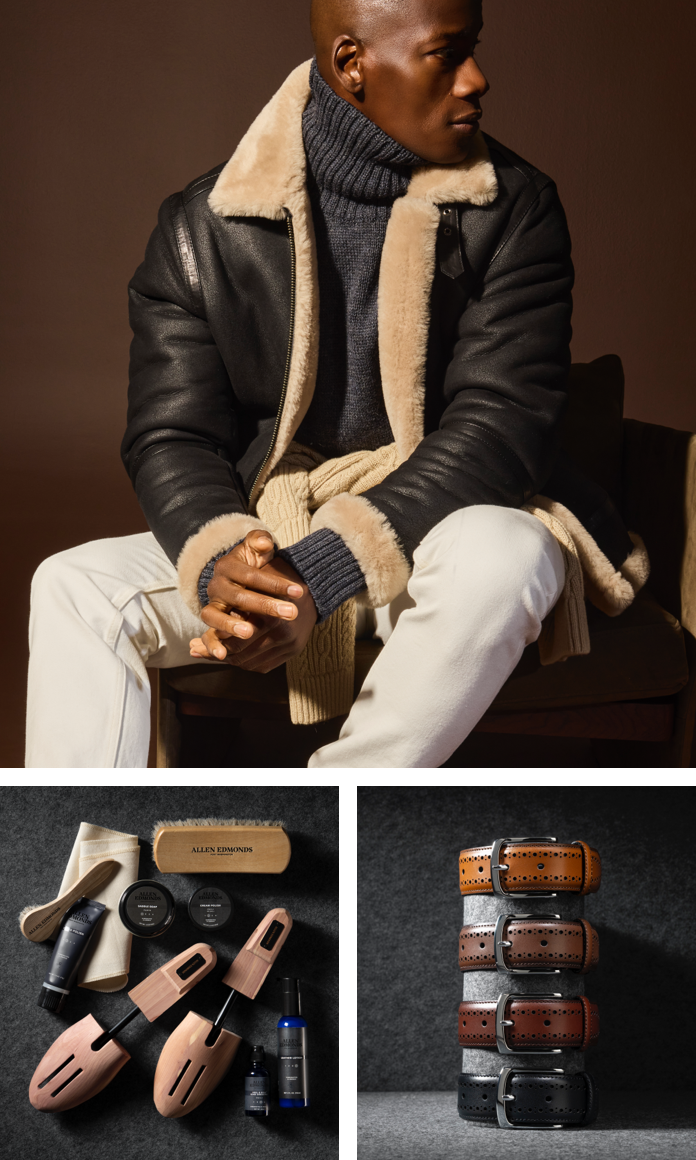 Various shoe care products including shoe trees, polishes, shoe brush, and a polishing cloth. Four men’s leather belts stacked on top of one another. One is black and the other three are various shades of brown. A man sitting in a chair modeling off-white jeans, a gray turtleneck sweater, and a black bomber jacket with a shearling collar.