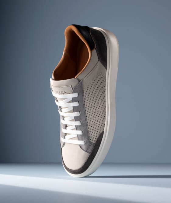 Men’s gray textured leather sneaker with tan rubber sole and brown leather lining